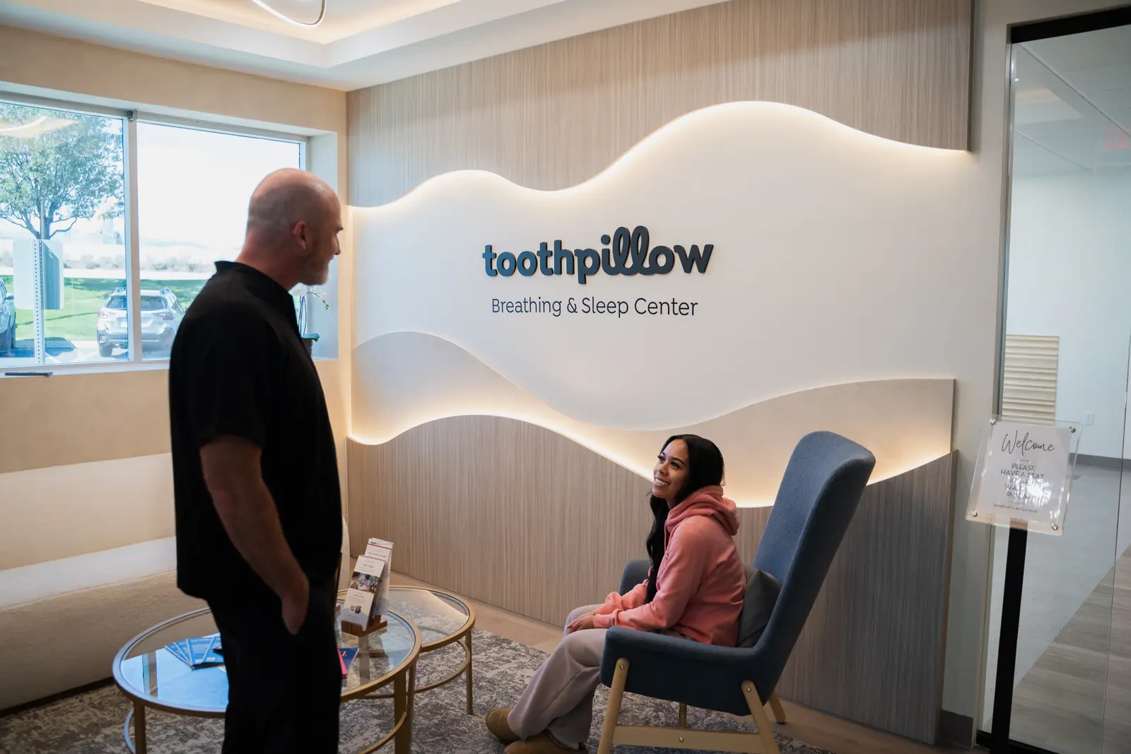 Dr. Jeff Buxton greeting a patient in the Toothpillow Breathing and Sleep Center waiting room in Draper, Utah