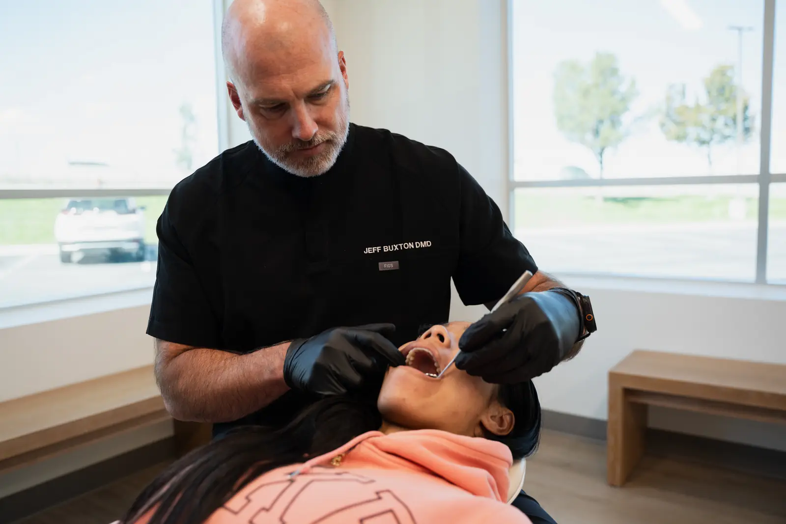 Dr. Jeff Buxton performing a hands-on jaw and bite exam for TMJ symptoms at Toothpillow Breathing & Sleep Center in Draper, Utah